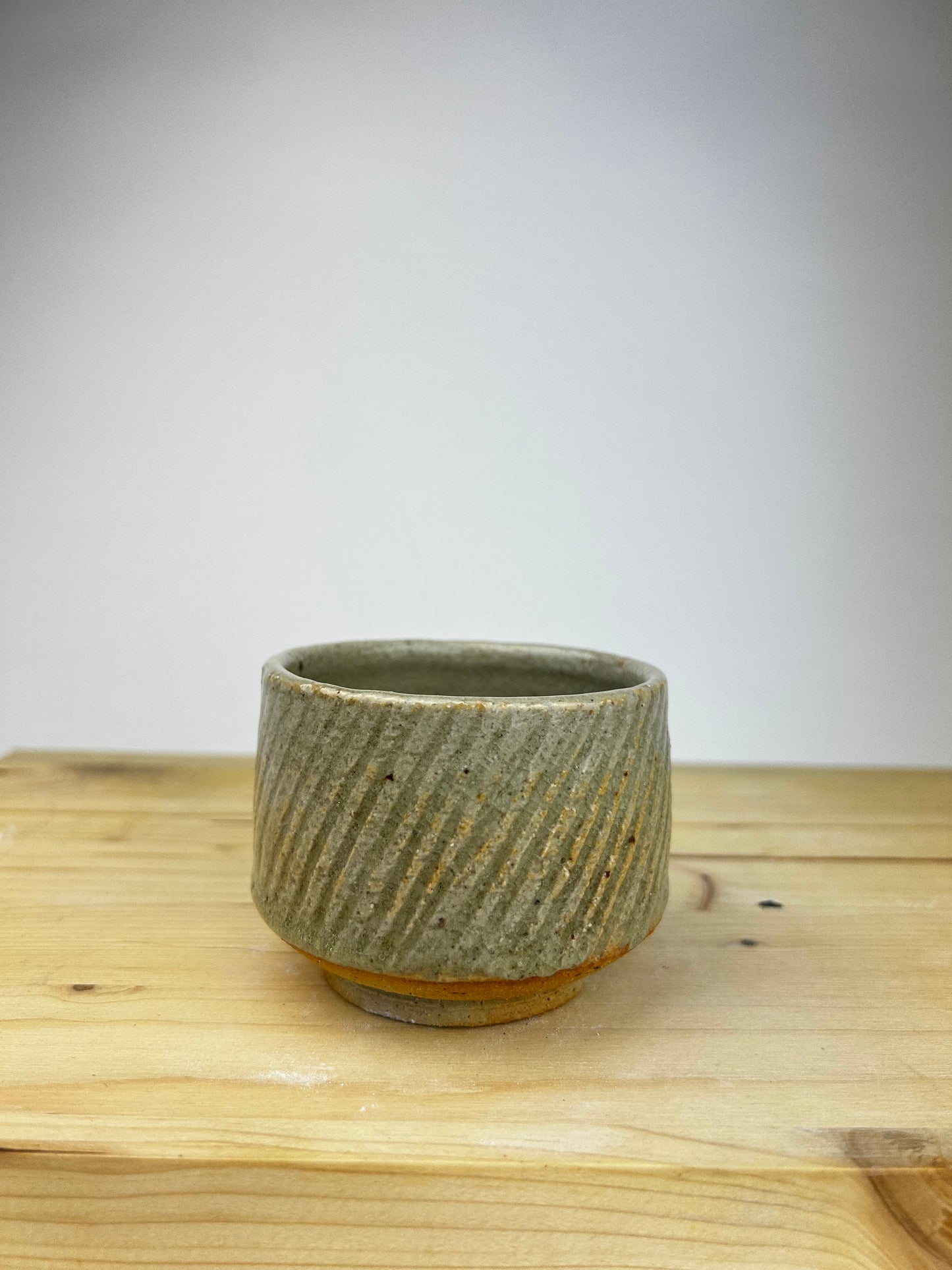 Textured celadon cup